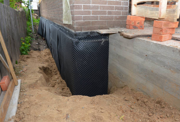 Happy homeowners after waterproofing job in Baileyton